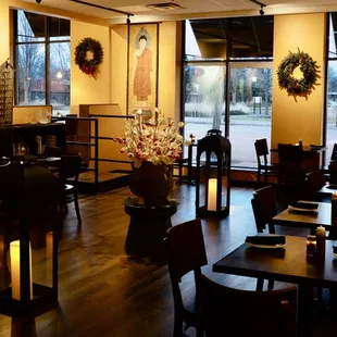 a dining area with tables and chairs