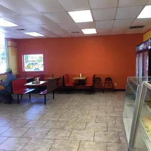 5 table for dining in and a bar with 6 bar stools also available