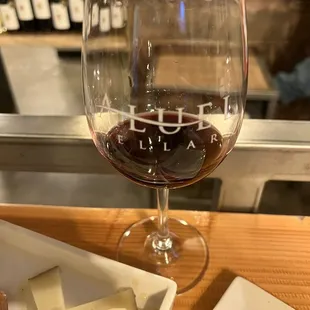 a glass of wine and cheese