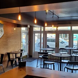 a dining room with a clock on the wall