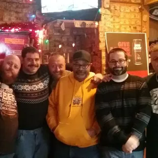 a group of men posing for a picture