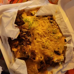 It looks poopy but the carnitas super nachos were pretty lit. 8/10