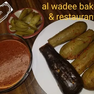 Zucchini and eggplant stuffed with rice and meat in red sauce