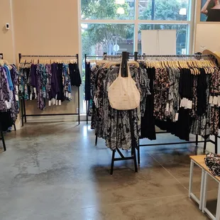 An assortment of clothing, tote bags, and accessories