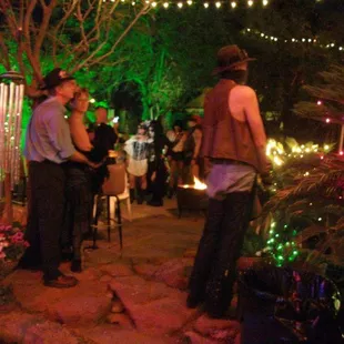 Crowded garden with live music, great people watching, and a wonderful sense of community