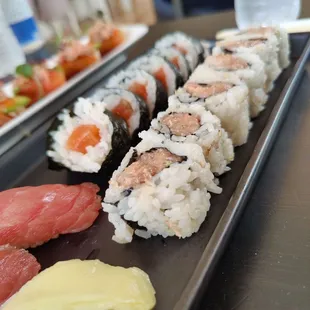 a long rectangular plate of sushi