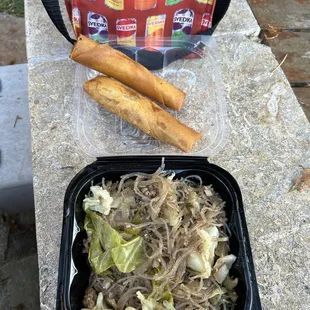 a lunch of noodles and breadsticks