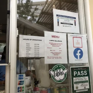 a window with menus and signs