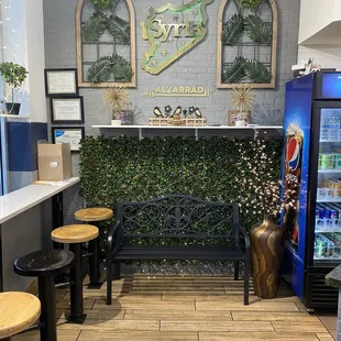 Entering the restaurant with kitchen and bar stools