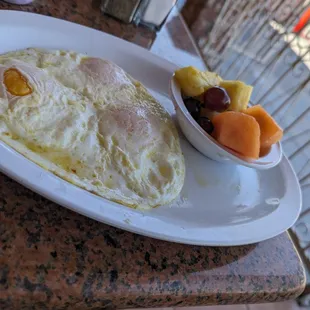 Eggs over easy with fruit