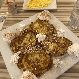 a plate of french toast and macaroni and cheese