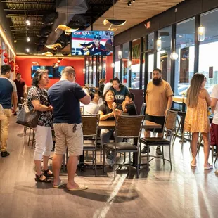 a group of people eating at a restaurant