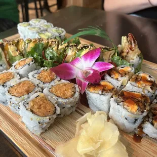 Spicy salmon roll, avocado roll, dragon roll, and sweet potato roll.