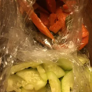 Carrots, jalapeños, onions with cucumbers.