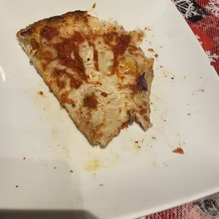 a slice of pizza on a plate