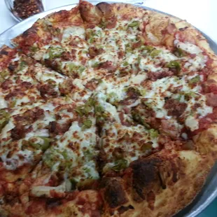 This a New Mexican pizza.  It has green chile,  bacon, chicken and mozzarella.