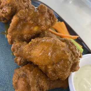 Buffalo chicken wings, made with our homemade creamy Buffalo sauce!