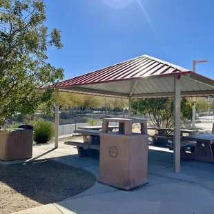 Picnic area with plenty of trash cans