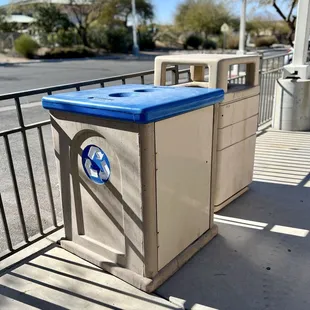 Recycling and trash cans near the bathrooms