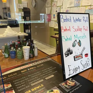 a menu displayed in a glass case