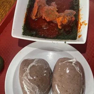 a plate of meatballs and a bowl of sauce