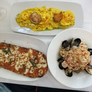 Margherita pizza, Pappardelle allo zafferano, and Risotto pescatore.