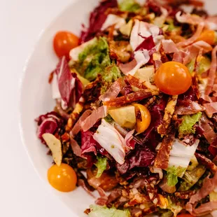 Lola Rosa Salad is our take on the Antipasta Salad with with prosciutto, salami, olives, &amp; artichokes.