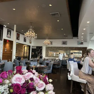 a woman sitting at a bar