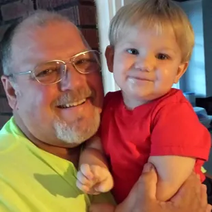 My precious grandson with hispapaw