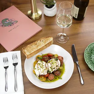 a plate of food with bread and wine