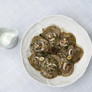 a plate of mushroom stroganoni with a glass of milk