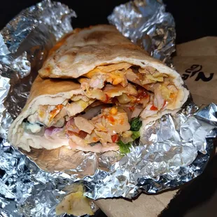 a burrito wrapped in aluminum foil