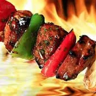 a skewer of meat and vegetables