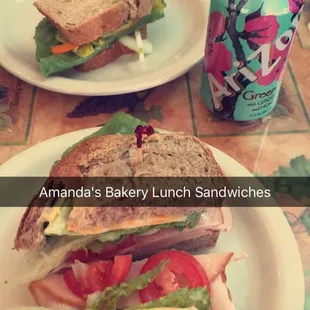 a sandwich and a can of soda
