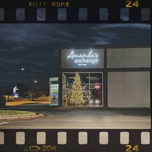 Amanda's Exchange building with lit Christmas tree inside