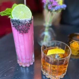 two cocktails on a table