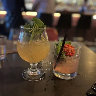 two cocktails on a bar