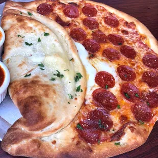 The Pizza Pie-Zoni , the best of everything. If pizza and calzone had a baby.....