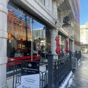 the entrance to a restaurant in the city