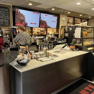 a man working at a restaurant counter