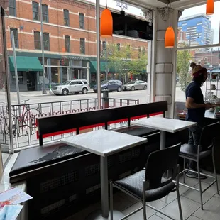 a woman sitting at a table in a restaurant