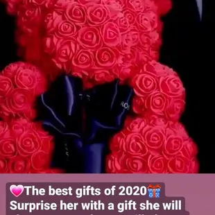 a red teddy bear with roses on it