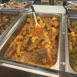 a variety of dishes in a buffet