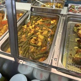 a variety of dishes in a buffet