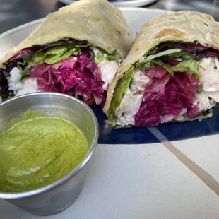 Chicken Salad Sandwich with pickled onions and pesto on a wrap