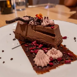 Amaro Flavored Sokolatina (Vegetarian, Gluten Free) Layered flourless chocolate sponge cake, dark chocolate mousse, and chocolate sauce