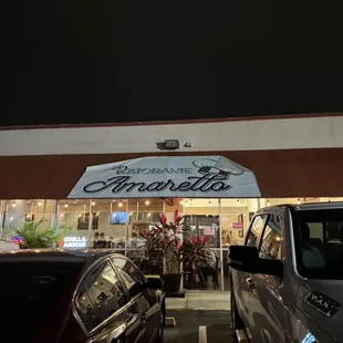 cars parked in front of a restaurant