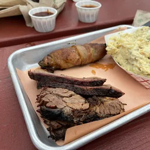 Brisket with potato salad and pig popper