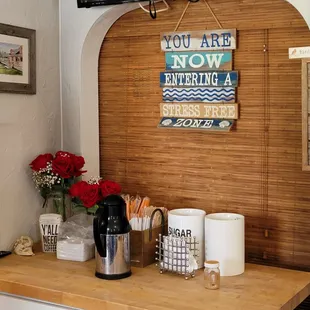 a coffee bar with a flat screen tv