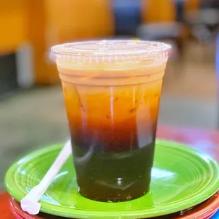 a plastic cup on a stack of plates